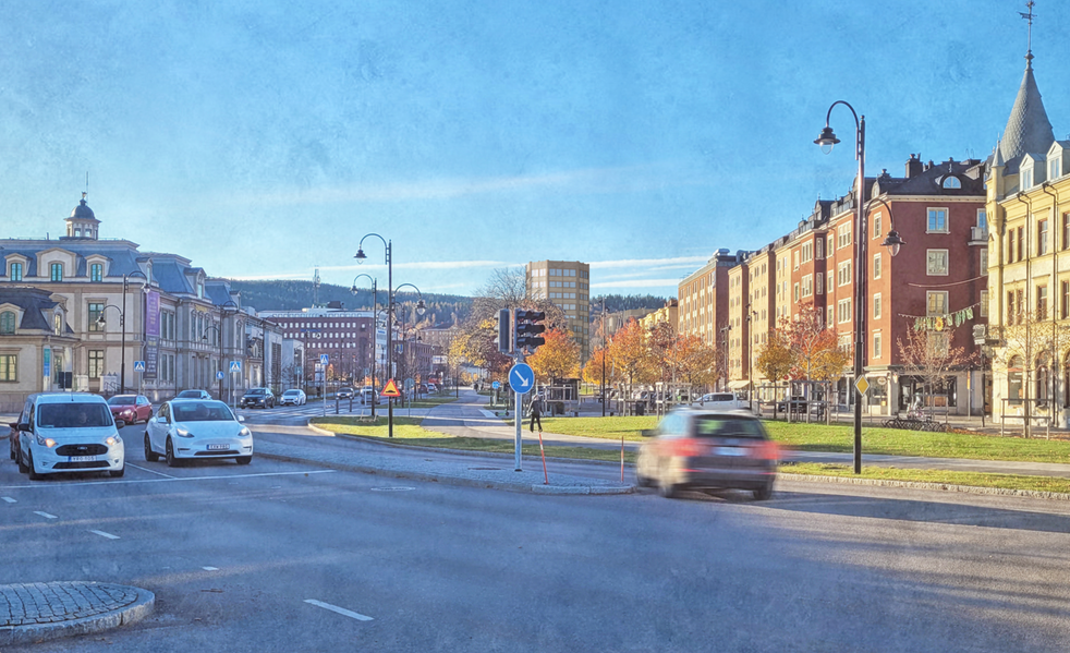 En illustration av två åttakantiga byggnader som syns i fjärran som en del av stadssiluetten. 